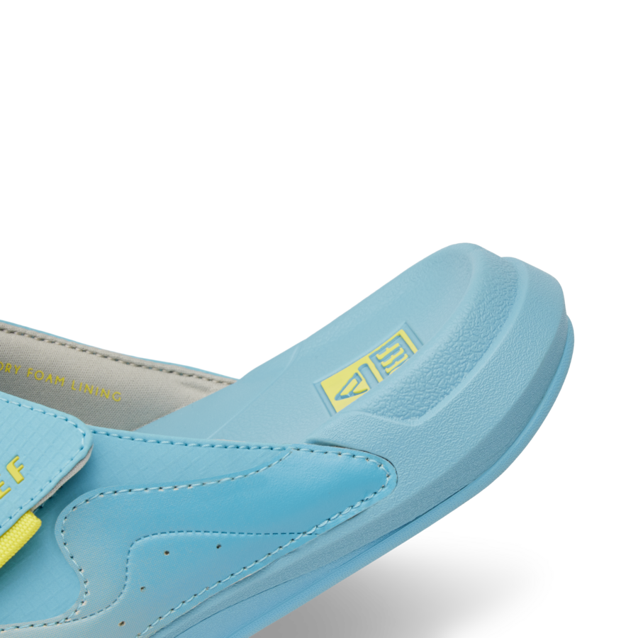 CJ7256_SWELL_CRUISER_SLIDE_LIGHT_BLUE_YELLOW_DTL2_png-900x900-c4cc11b.png